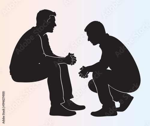 Silhouette of two people sitting and talking in deep conversation