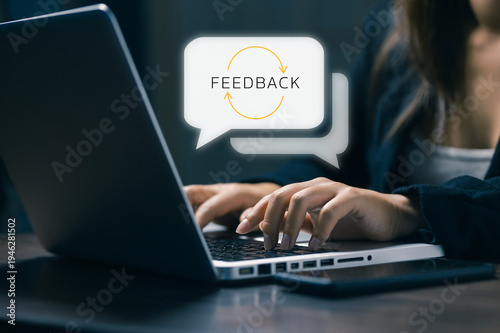 Businesswoman typing on laptop with digital feedback speech bubble interface. Concept of customer experience, online review, service evaluation, user feedback, communication and customer satisfaction.
