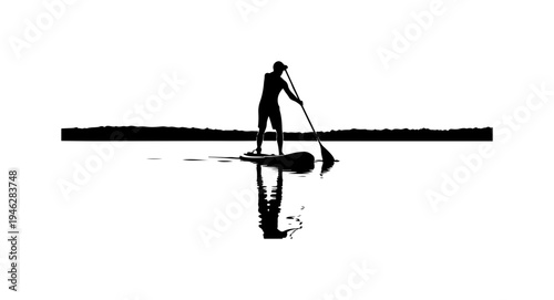 Silhouette of a person paddleboarding on a serene lake at sunrise