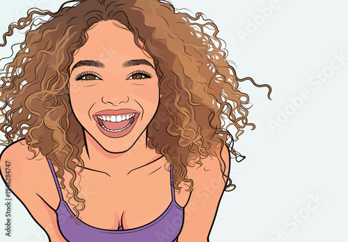 A girl with curly hair laughs and smiles while posing in front of a light background during a fun moment indoors.