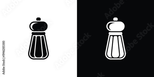 Black and white pepper mill on split background spice mill