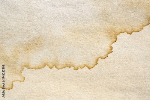 Old vintage paper texture background with aged stains and antique yellowed parchment effect