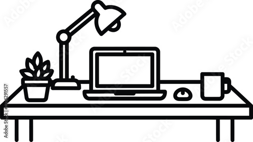 Home office workspace with laptop lamp potted plant and coffee cup on desk