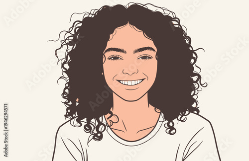 A young person with curly hair smiles at the viewer in a simple setting. The person looks happy and relaxed while wearing a casual shirt.