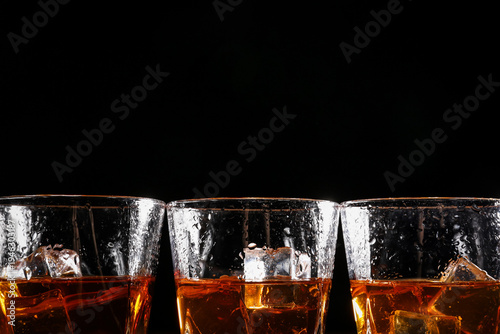 Glasses of cold whiskey on ...
