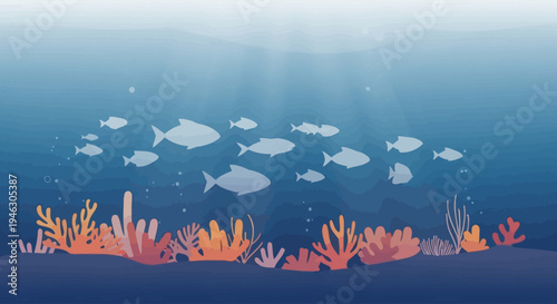 School of fish swimming above coral reef in blue ocean