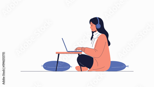 Young Woman Working on Laptop with Headphones on Floor
