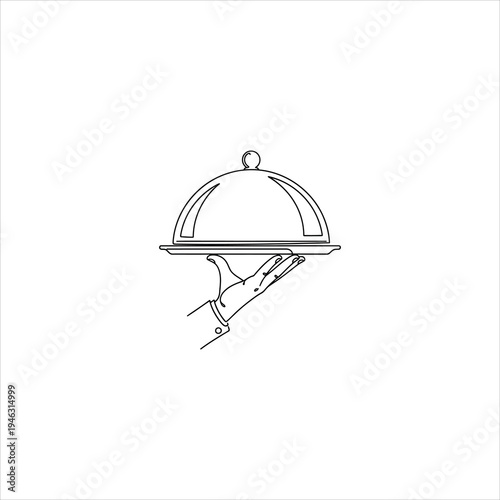 A hand holding a covered serving dish