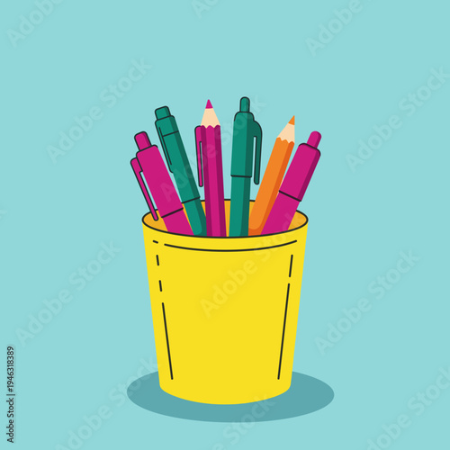 Colorful writing instruments in a bright yellow cup against a turquoise background