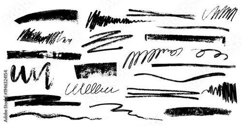 Assortment of black brush strokes and scribbles, including lines, swirls, and textured marks for design.