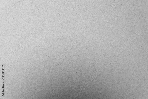 Plain light silver grey tone color paint on blank rough paper texture background with space minimalist style 