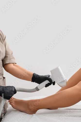 Female cosmetologist perfor...