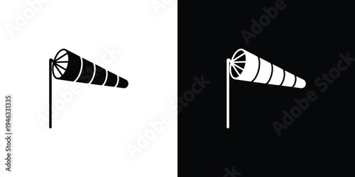 Black and white striped windsock on a pole stripes