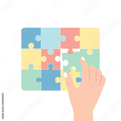 Hand placing last puzzle piece, completing a colorful jigsaw on white background