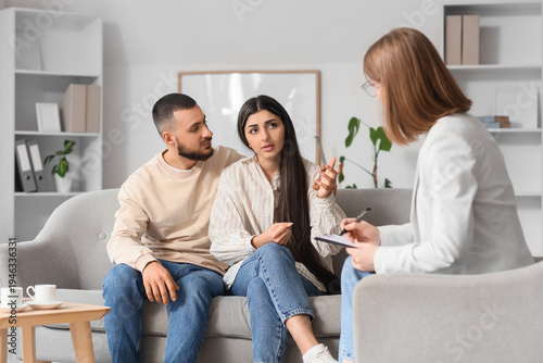 Young couple talking with f...