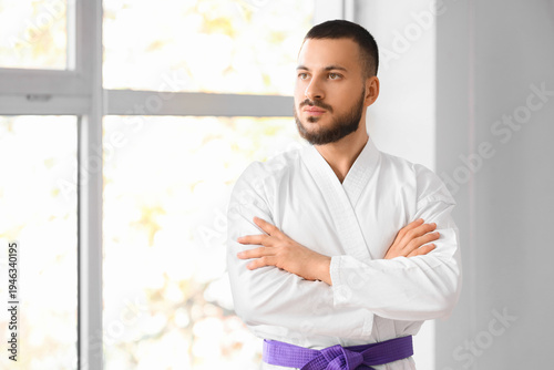 Young man with purple belt ...
