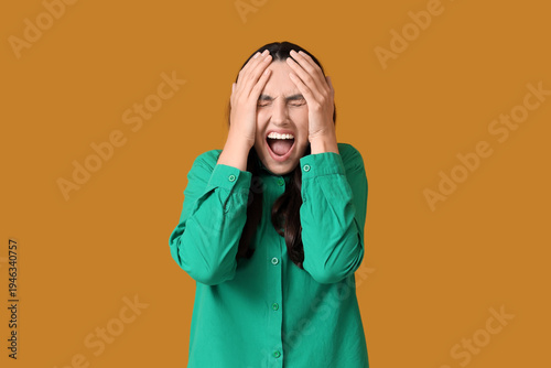 Young woman screaming on or...