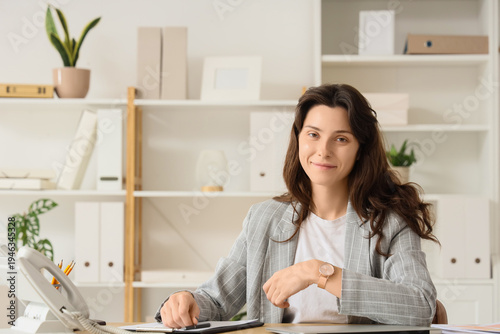 Smiling young businesswoman...