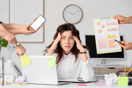 Overwhelmed young businessw...