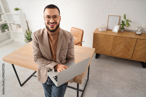 Young businessman using lap...