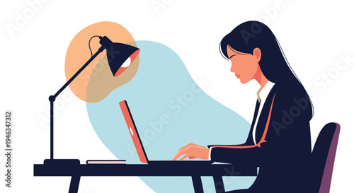 Professional woman working diligently on her laptop at a desk illuminated by a desk lamp during late night hours in a modern office space.