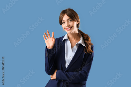 Young businesswoman waving ...