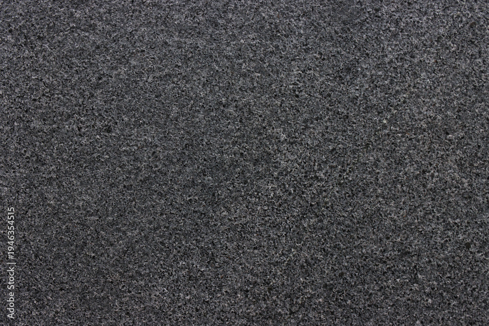 Fototapeta premium Dark, textured carpet fills the entire frame