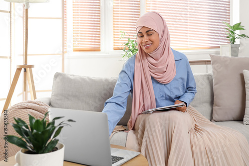 Young Muslim woman learning...