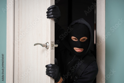 Male thief breaking through...