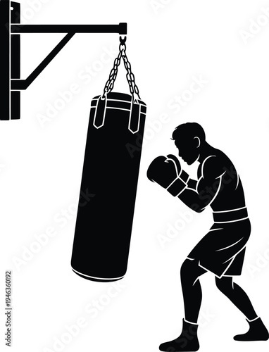 Male boxer hitting a heavy bag during a training session, working on his technique