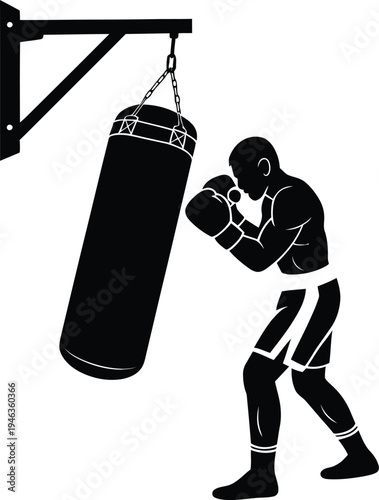 Male boxer hitting a heavy bag during a training session, working on his technique