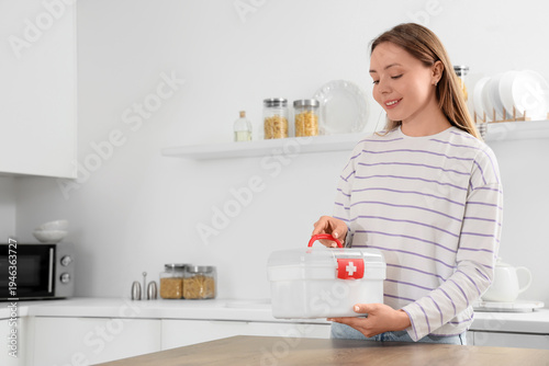 Young woman with first aid ...