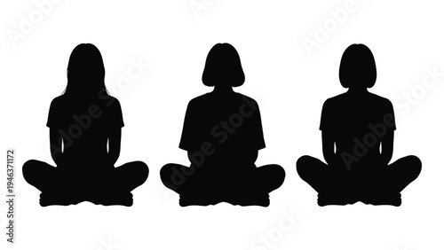 Three women silhouetted in a meditative lotus position facing forward