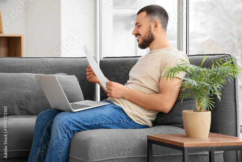 Young man with refund form ...