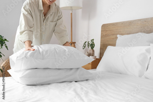 Young woman stacking soft p...