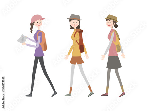 会話しながらハイキングをする若い女性たち