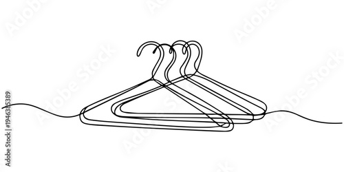 Hands holding cables and ropes with assorted coat hangers isolated on a white background