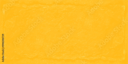 vibrant yellow textured paper background with weathered edges and rough fiber grain for artistic design backdrop