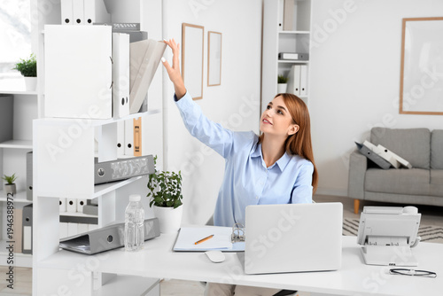 Young businesswoman taking ...