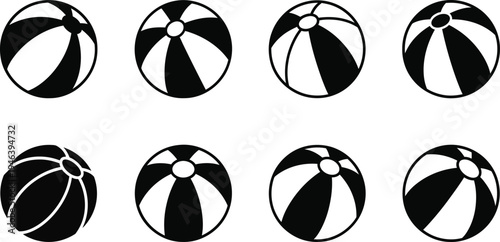 Various black and white beach balls in different designs and patterns
