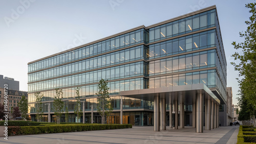 Modern Glass Office Building With Metal Canopy And Landscaped Courtyard For Corporate Business Concepts