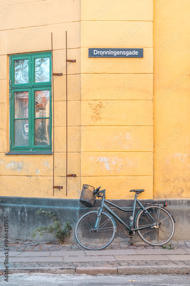 Fototapeta premium Bicycle Parked Against Yellow Building, Christianshavn, Copenhagen