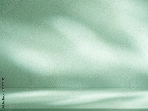 Green wall background with natural leave shadow,light on mint green floor.Minimal abstract interior backdrop,Blank stand podium for Product display mockup,Cosmetic advertising design,Kitchen wall room