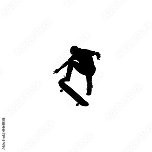 Silhouette of a skateboarder performing a trick