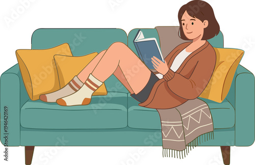Woman reading a book while sitting on a couch with pillows.