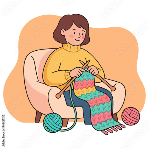 Woman sitting on chair creating colorful knitted blanket with yarn balls nearby indoors