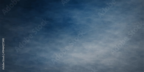 Dramatic dark blue sky cloudscape with white clouds over a summer nature background under a light sun showing atmospheric weather and air