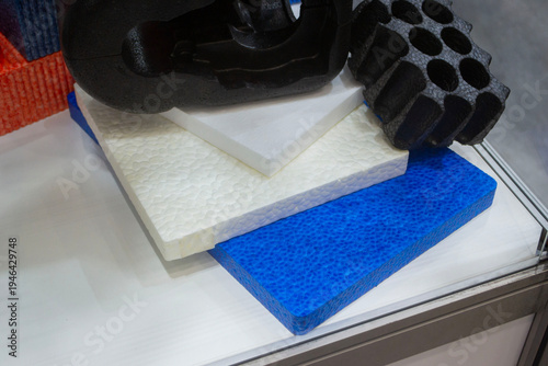 Products made from foamed polymers expanded polypropylene EPP and expanded polystyrene EPS. Model of dense and lightweight material, universal foam. New modern technologies. Industrial manufacturing
