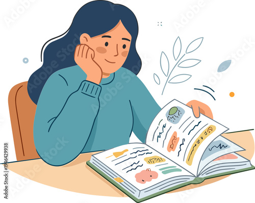 A woman reads an open book sitting at a desk indoors