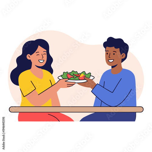 Man and woman sitting at a table eating salad together happily indoors